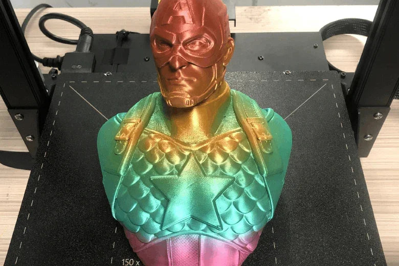 Multicolor 3D printed Captain America bust on 3D printer bed