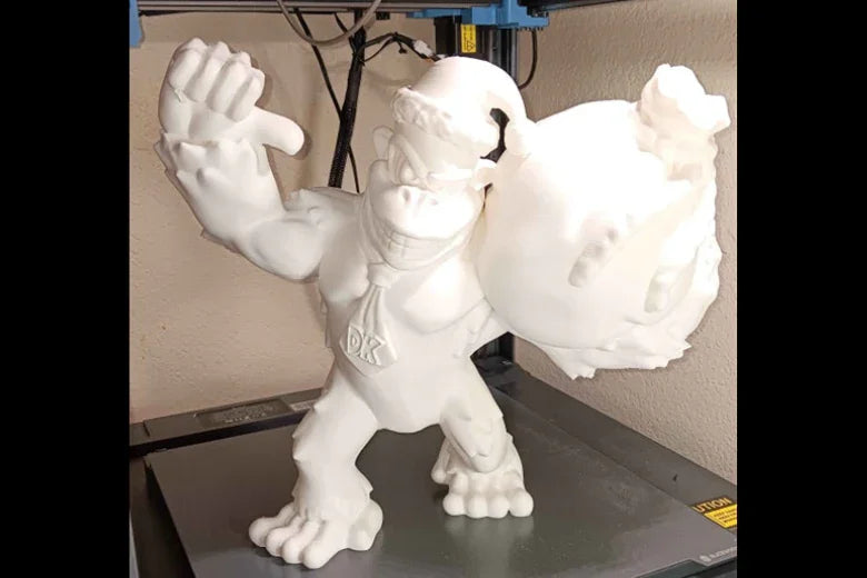3D printed Donkey Kong figure with DK tie on a 3D printer platform