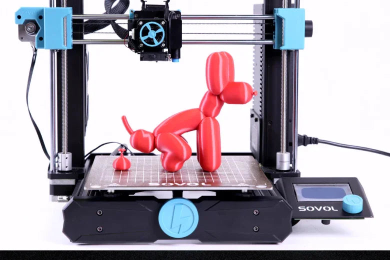 Sovol 3D printer creating red balloon dog models on build plate