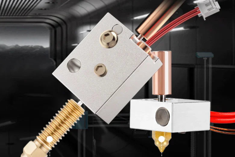 Close-up of 3D printer hotend assembly with metal nozzle and wiring in a dark industrial setting