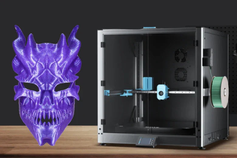 Large 3D printer and purple dragon mask on wooden table, dark background